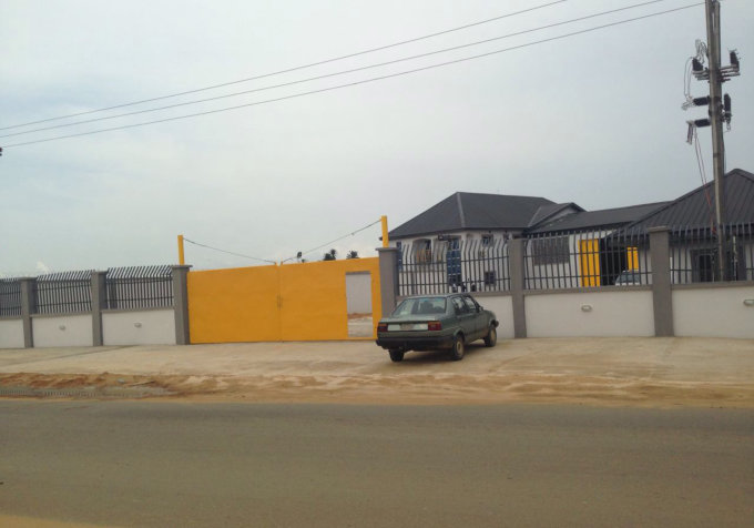 yellow gate with parked car